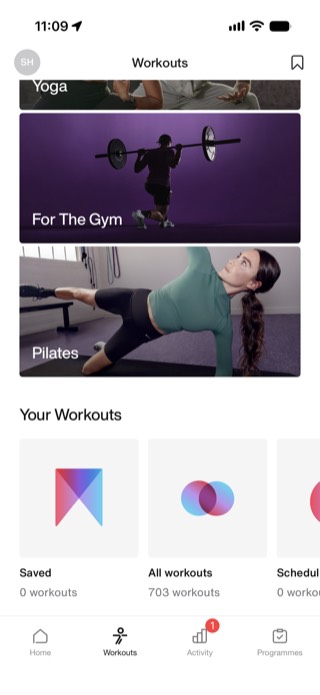 Nike Training Club Workouts tab showing category browsing and 703 total workouts